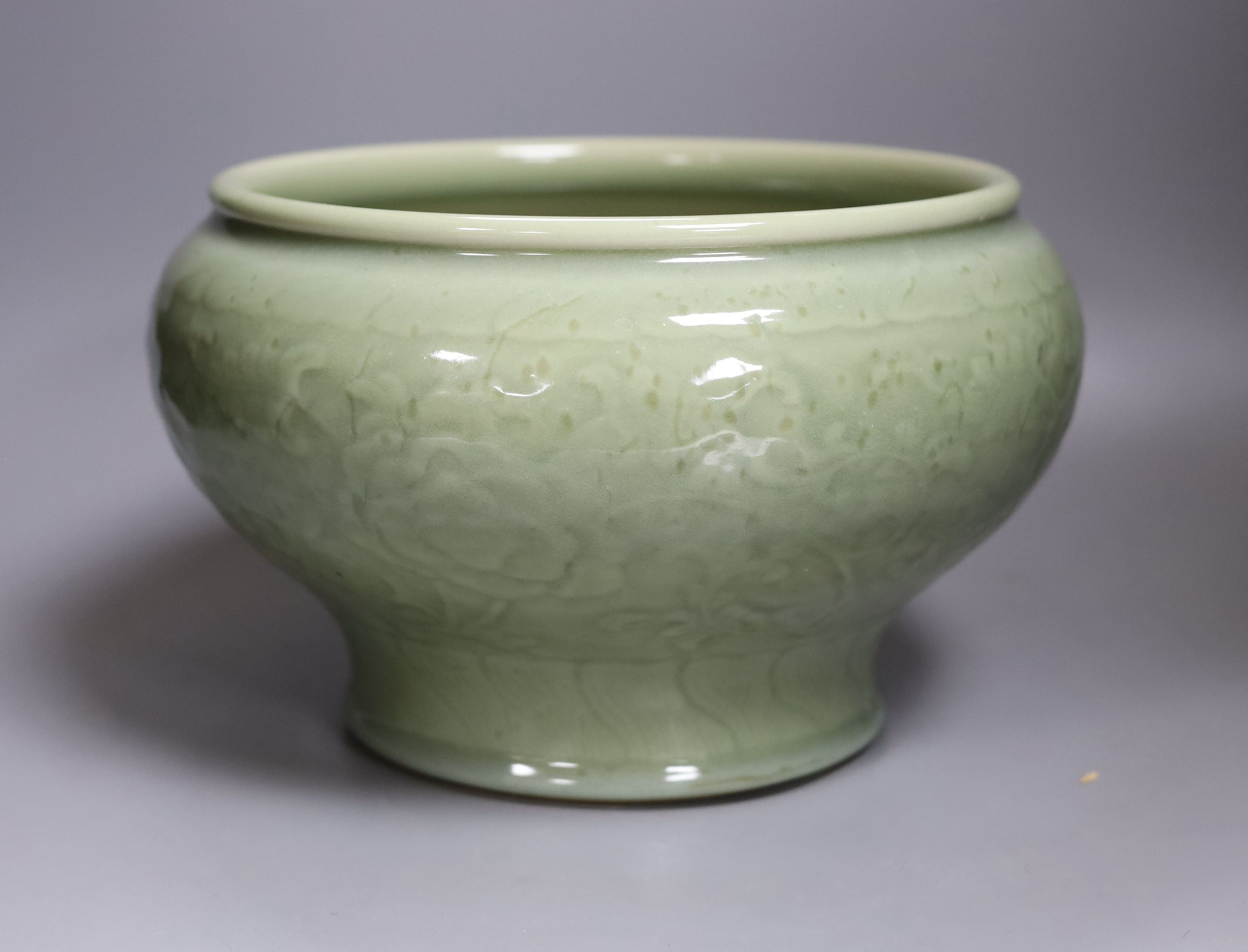 A Chinese celadon glazed bowl - 17.5cm tall